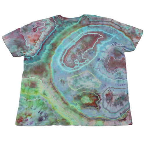 Back view of a teal, magenta, and seafoam Chaos Magic geode tie-dye t-shirt by Regular Magic featuring flowing organic dye rings.