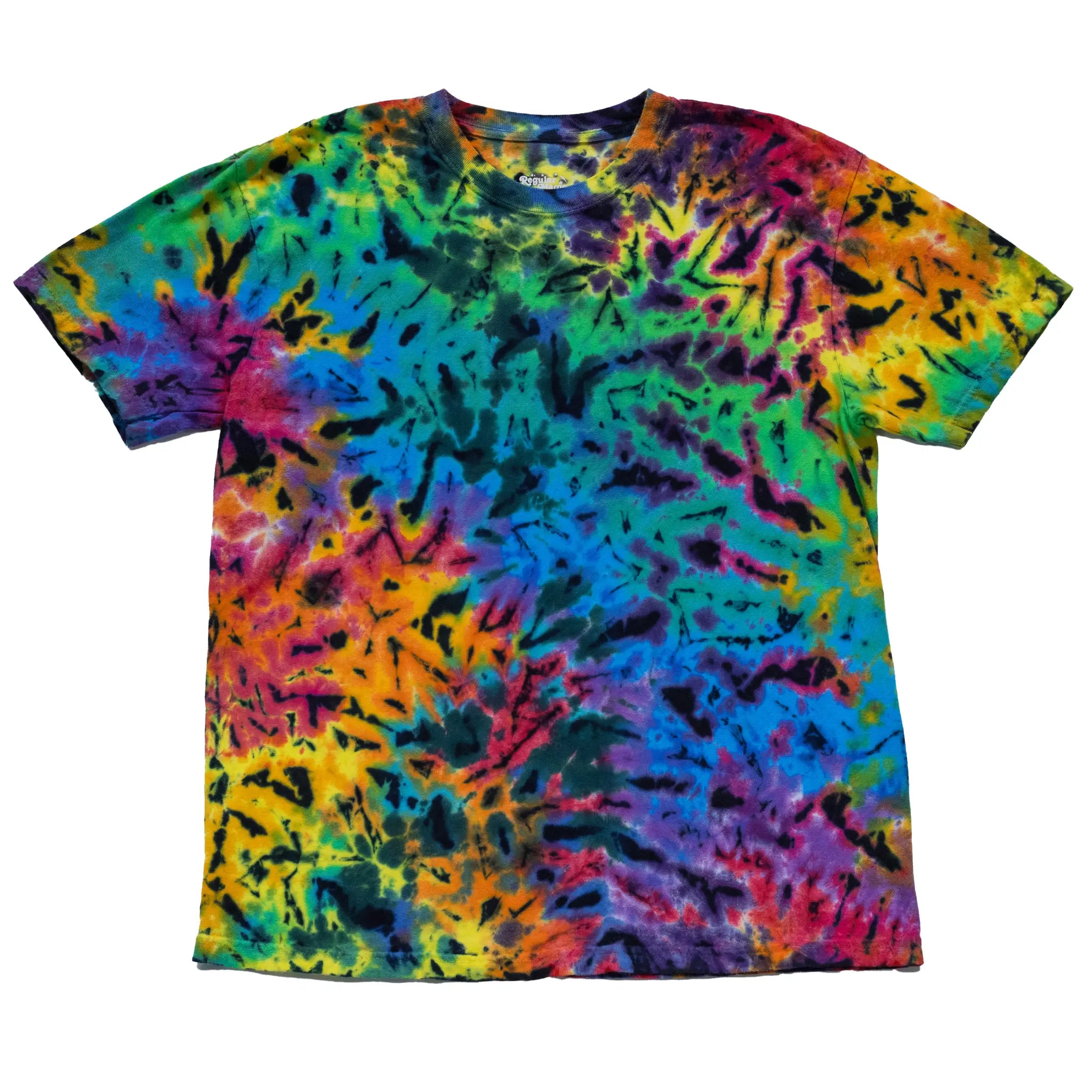 Front view of a custom rainbow tie-dye t-shirt by Regular Magic featuring a full-coverage colorful ice dye design with dark contrast splits across yellow, green, teal, and magenta hues.