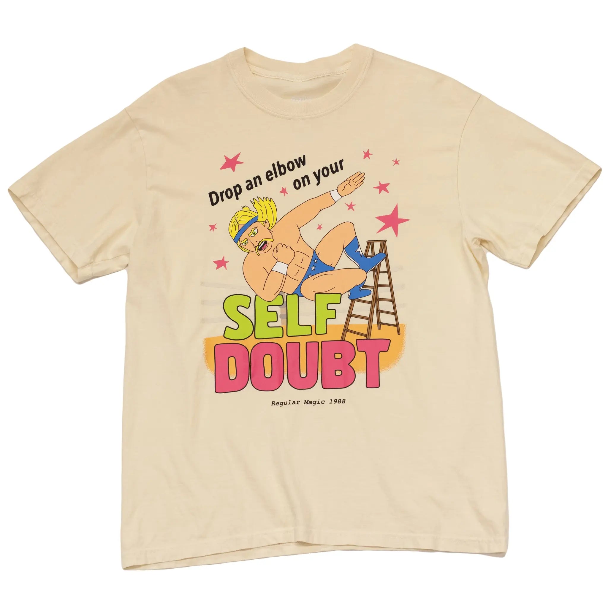 Front view of a cream cotton t-shirt by Regular Magic featuring the Self Doubt Slammer wrestler character diving off a ladder with the text 'Drop an elbow on your SELF DOUBT'.
