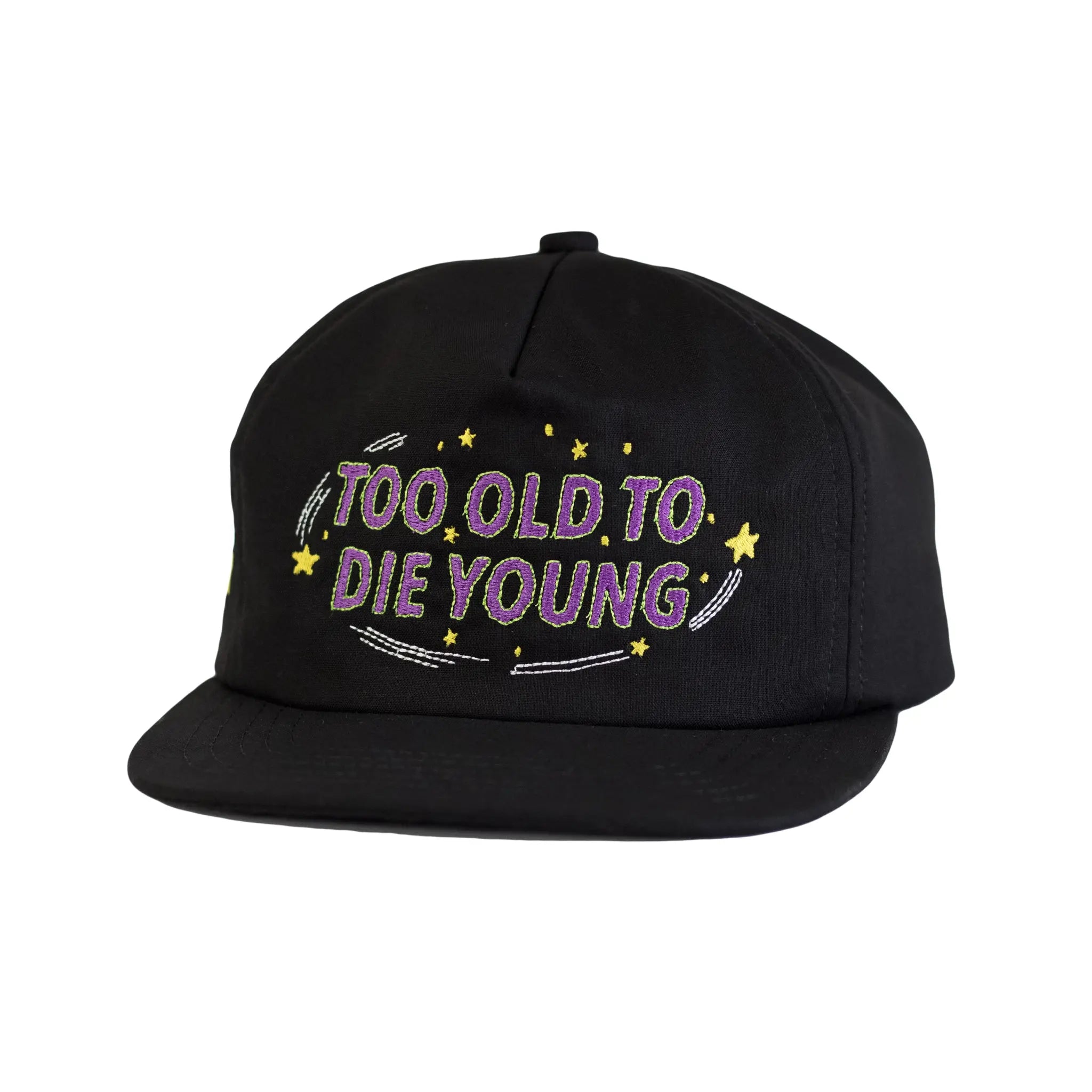 Front profile view of a black Regular Magic cap embroidered with the phrase 'TOO OLD TO DIE YOUNG' in purple text surrounded by yellow stars.